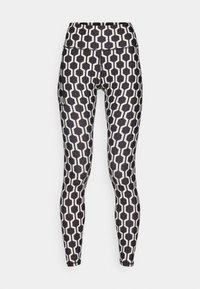 Černobílé legíny s geometrickým hexagonálním vzorem, vysoký pas, vyrobené z elastického materiálu. Obsahují boční kapsu a mají přiléhavý střih.