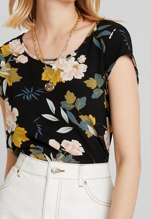 Black floral top featuring short sleeves, a round neckline, and colorful flower patterns in yellow, pink, and blue on a smooth fabric.