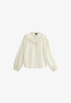 Blusa blanca de manga larga con cuello y puños con volantes, que presenta un detalle de lazo en la parte del cuello. Confeccionada en una tela ligera con un acabado texturizado.