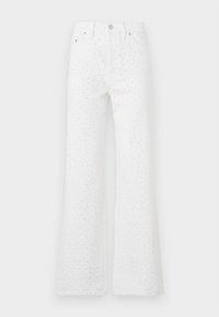 Bílé rozšířené džíny z texturované látky s černými tečkami. Design s pěti kapsami a uzavíráním na předním tlačítku a zip.