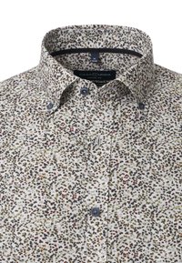 Short-sleeve shirt with a white base featuring a scattered brown, green, and red animal print. Collared with button details. Cotton material.
