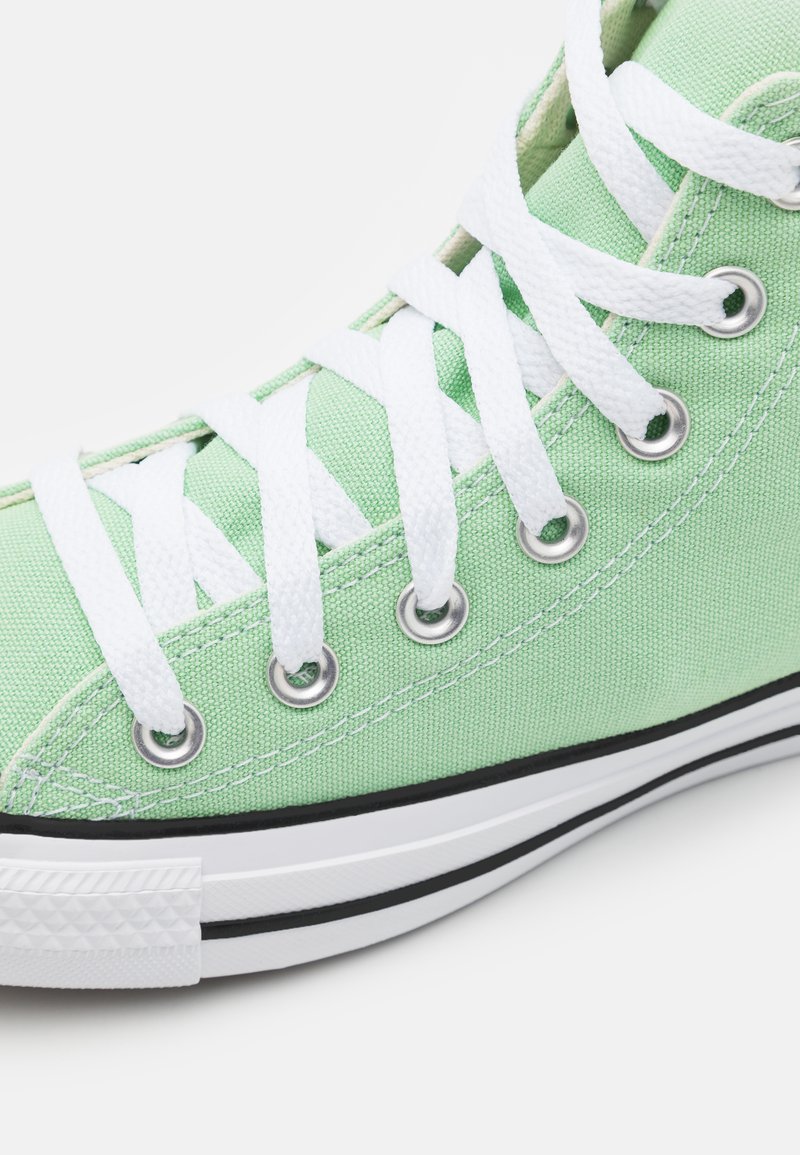 green sneakers converse