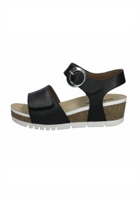 Schwarze Lederwedge-Sandale mit verstellbarem Riemen, kreisförmiger silberner Schnalle, Kork-Zwischensohle und weißer Gummi-Laufsohle. Glatte Innenauskleidung.