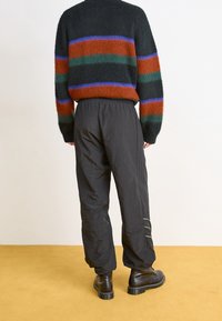 adidas Originals Teplákové kalhoty - black