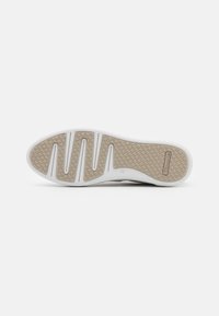 Shoe sole with a white edge and a textured light brown rubber bottom featuring deep grooves, offering grip and support. Size 37 marked.