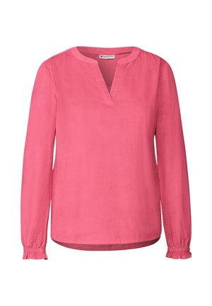 Vaaleanpunainen pitkähihaise vestido, jossa on V-pääntie ja kerätty hihansuun. Sujuva rakenne, kevyt kangas ja rento istuvuus.