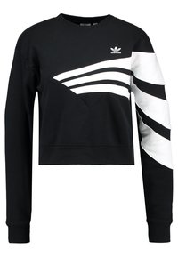 Black cropped sweatshirt with white diagonal stripes and a small logo on the chest. Made of cotton with a smooth texture and long sleeves.