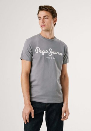 T-shirt gris en coton, arborant un logo imprimé blanc "Pepe Jeans LONDON" sur la poitrine. Design à manches courtes et col rond.