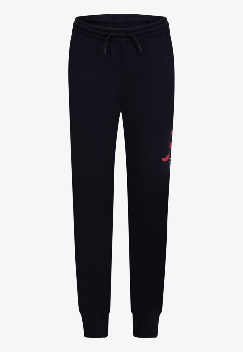 Černé teplákové kalhoty s elastickým pasem a šňůrkou, zužující se nohavice s manžetami a částečná červenobílá grafika na pravém stehně.