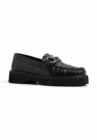 Black loafers in crocodile-embossed leather, featuring a silver decorative buckle, sturdy platform sole, and detailed stitching along the edge.