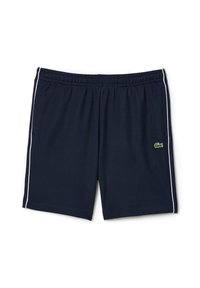 Shorts de sport bleu marine avec un liseré blanc sur les côtés, une ceinture élastique, des poches latérales, et un petit logo crocodile vert sur la jambe droite.