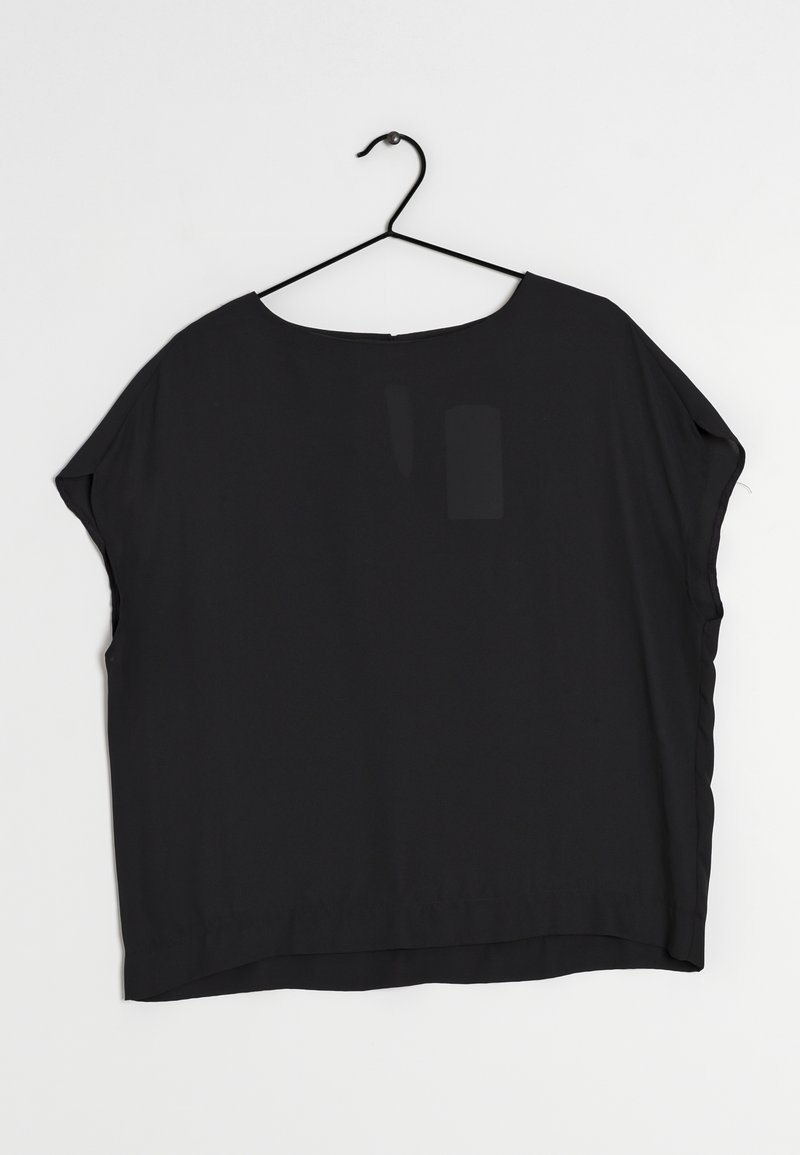 Next Pusero - black