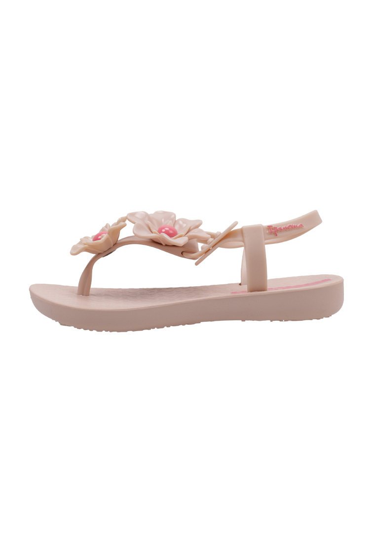 Chanclas de goma rosas con adornos florales, suela plana y plantilla texturizada. Correas ajustables para mayor comodidad.