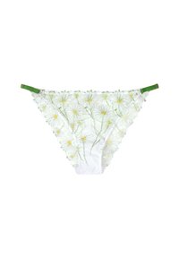 String en dentelle blanche orné de marguerites brodées en vert et jaune, avec des bretelles vertes. Design floral complexe sur un tissu transparent.