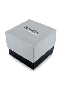 Petite boîte bicolore grise et noire avec le logo "BREIL TRIBE" imprimé sur le couvercle gris, placée sur un fond blanc.