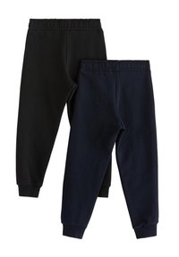 Δύο ζευγάρια φόρμες με ελαστική μέση: ένα σε μαύρο και ένα σε σκούρο ναυτικό μπλε. Και τα δύο έχουν μανσέτες στους αστραγάλους και απαλή, λεία υφή.