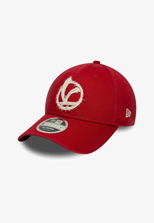 Red adjustable baseball cap with frayed white embroidered logo on front and New Era brand tag on the side and visor.