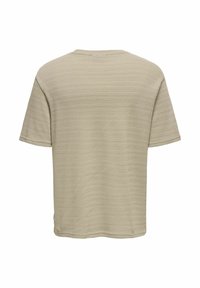 Beige T-shirt met korte mouwen, voorzien van een textuurpatroon, een ronde halslijn en een relaxed fit. Heeft een klein logo-label aan de zijkant van de zoom.