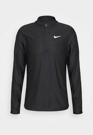 Pullover de sport noir à manches longues avec zip au quart, motif en grille subtil et logo Nike Swoosh blanc sur la poitrine.