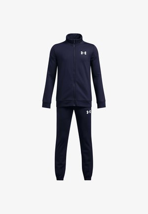 Tumesinine jope tõmblukuga ja sobivad püksid valgete Under Armouri logodega rinnal ja reitel, spordiriiete komplekt.