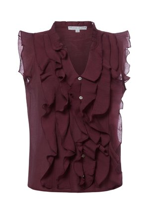Mouwloze donkerpaarse blouse met geplooid voorpand en kraag, halfdoorzachte stof en kleine witte knopen middenvoor.