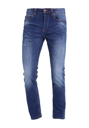 Jeans de mezclilla azul con corte ajustado, que cuentan con cinco bolsillos, una cremallera y un desgastado sutil para un aspecto usado. Acentos de costura en color naranja.