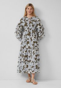 Luftiges, olivgrünes Maxikleid mit weißem Blumenmuster. Verbunden mit Rüschensäumen, Kordelzug-Ausschnitt und gestuftem Saum. Leichter Stoff.