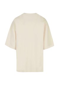 Kremfarget oversized T-skjorte, kort erm, rund hals, bomullsmateriale, glatt tekstur, ingen synlige logoer eller mønstre.