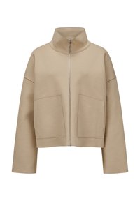 Beige cropped Jacke aus weichem Material, mit hohem Kragen, Frontreißverschluss und großen aufgesetzten Taschen. Lockerer Schnitt mit eingesetzten Schultern.