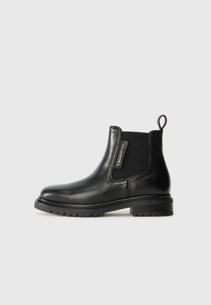Black leather ankle boot with elastic side panels, rounded toe, pull tab at heel, and textured rubber sole. Simple design, smooth finish.