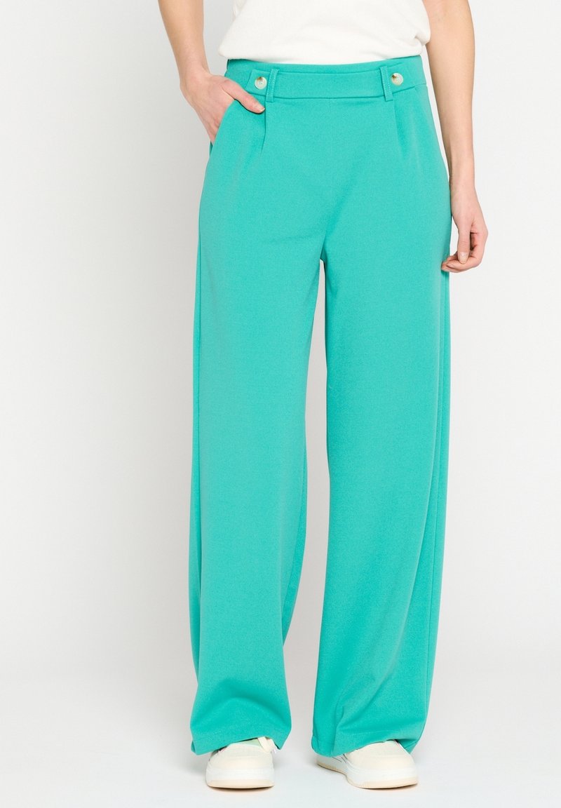 Turquoise wide-leg trousers made of soft fabric, featuring a flat front, two buttons at the waistband, and side pockets.