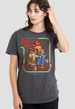 Young girl hugging a horned cat sitting inside a pentagram with lit candles, text reads "Caring for your Demon Cat, Pets & Responsibilities."