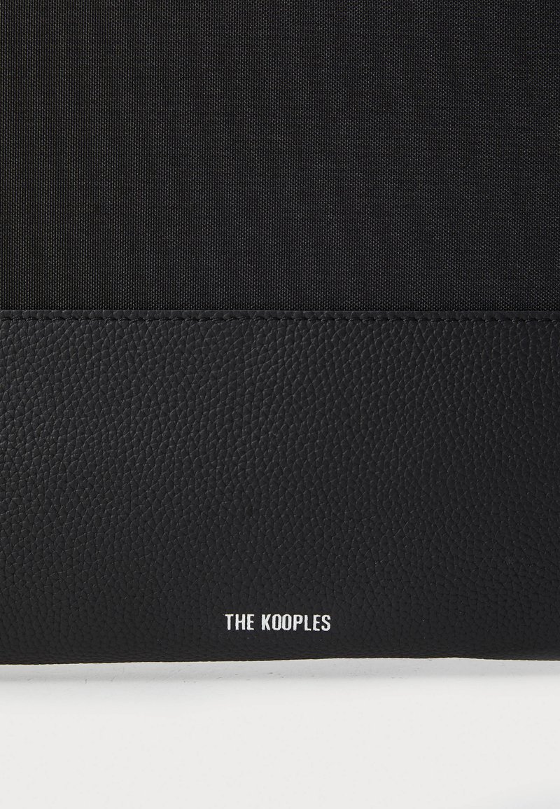 Parka longue polyester noire à capuche | The Kooples - France