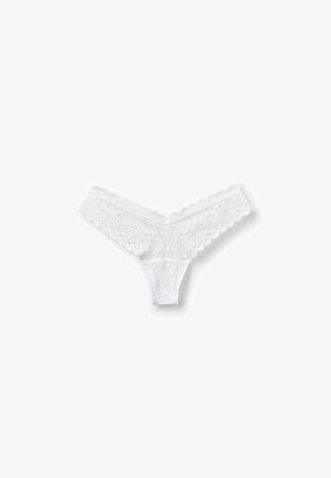 Weiße Spitzenunterwäsche mit floralen Mustern, gewellten Kanten und transparenter Textur. Zartes und leichtes Design.