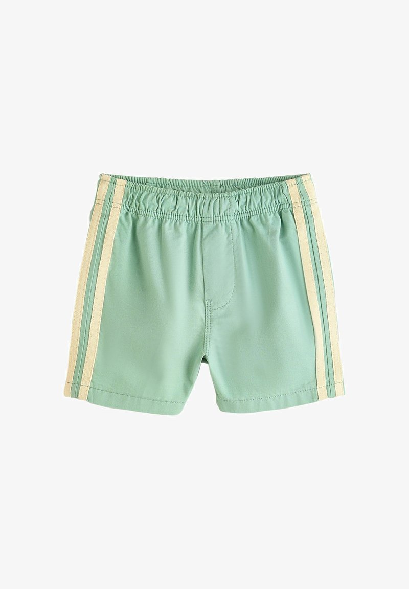 Shorts vert clair avec taille élastique et deux bandes verticales beiges sur chaque côté, posés à plat sur un fond blanc.