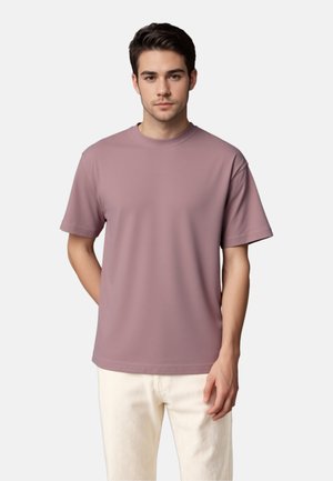 Korte mouwen, T-shirt met ronde hals in een effen mauvekleur. Gemaakt van glad, rekbaar materiaal met een ontspannen pasvorm en minimale stikseldetails.