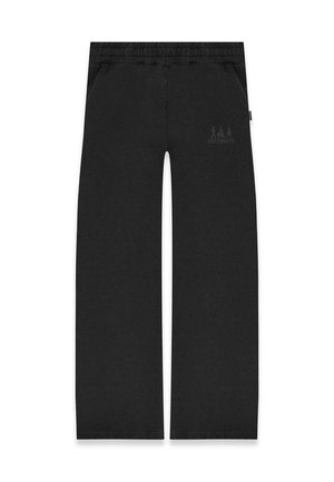 Schwarze Jogginghose mit entspannter Passform, elastischem Bund, zwei Seitentaschen und einem dezenten Logo-Print am linken Oberschenkel. Weiches Baumwollmaterial.