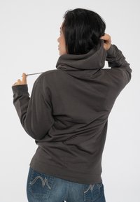 Hooded sweatshirt in dark gray cotton blend, featuring a drawstring, ribbed cuffs, and a relaxed fit. Back view reveals smooth texture.