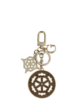 Porte-clés Guess ton or avec breloques ajourées circulaires et en forme d’étoile et un fermoir de marque pour attacher des clés ou des sacs.