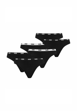 Cinco calzoncillos negros tipo slip de Puma con cinturillas elásticas con el logotipo de la marca, colocados parcialmente superpuestos sobre un fondo blanco.
