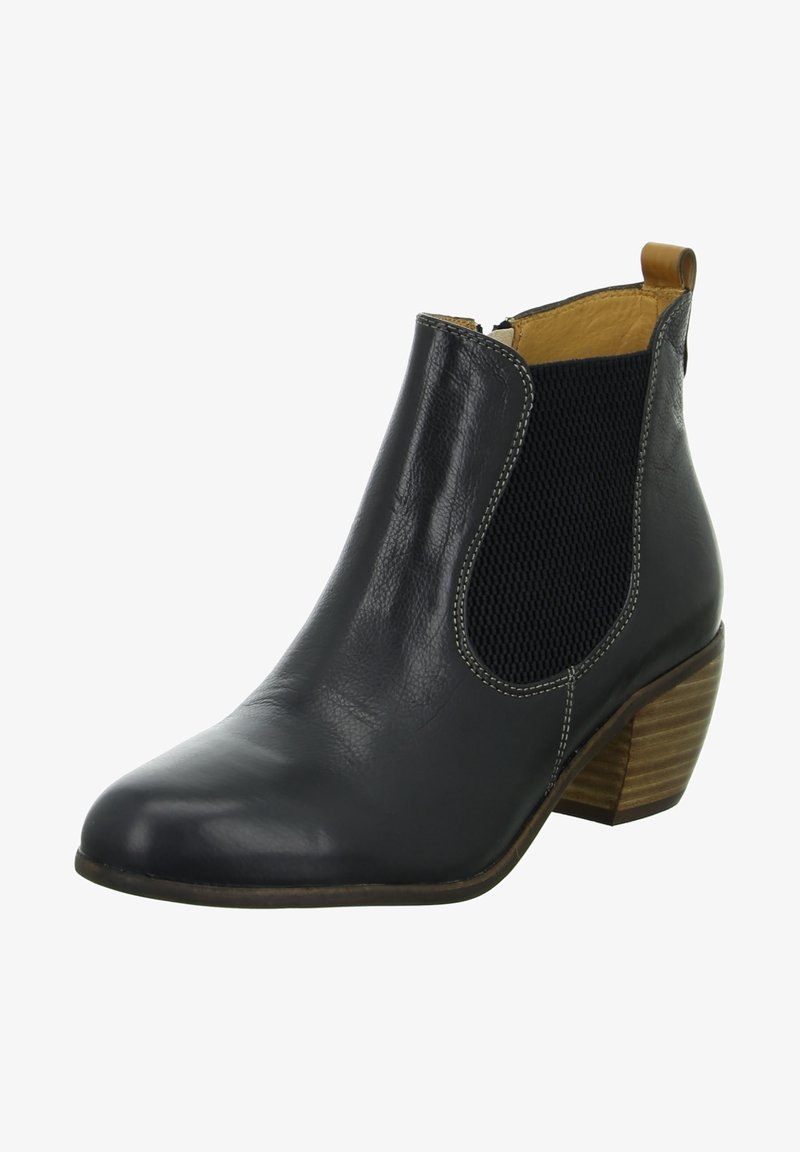 Bottine noire en cuir avec panneaux latéraux élastiques, languette beige, coutures blanches et petit talon en bois superposé.