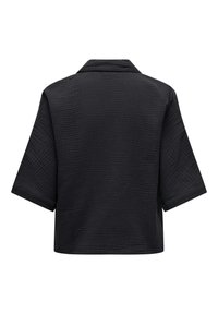 Chemise noire à manches courtes avec un col structuré. Tissu texturé avec un motif subtil, présentant une coupe ample et un ourlet droit.