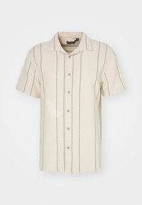 Krémová košile s krátkým rukávem, s vertikálními šedými pruhy, s designem na knoflíky, měkkou texturou a s výstřihem do V. Ležérní a prodyšný materiál.