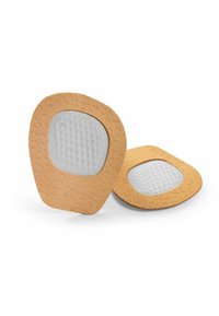 Coussins adhésifs rembourrés pour les pieds avec un extérieur texturé couleur beige ; une couche intérieure grise matelassée, conçue pour le confort et l'atténuation des points de pression.