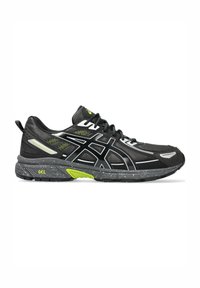 Black running shoes with a mesh upper, reflective silver accents, green GEL cushioning, and a textured grey speckled sole.