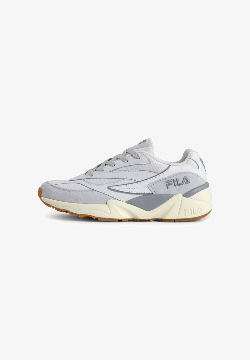 Gray athletic sneaker with a mesh and suede upper, featuring white accents, a thick white sole, and textured gum rubber outsole.