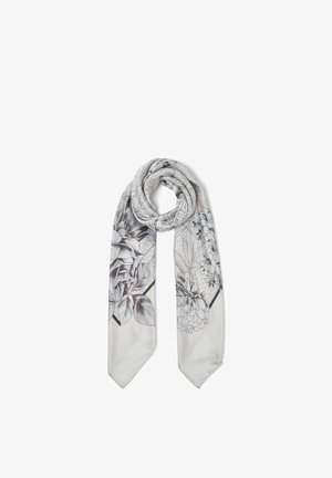 Hellgrauer Seidenschal mit schwarz-weißen Blumenmustern, locker verknotet vor weißem Hintergrund drapiert.