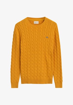 Gelber Kabelstrickpullover mit Rundhalsausschnitt, gerippten Bündchen und Saum. Mit einem kleinen gestickten Logo auf der Brust. Aus weichem Stoff gefertigt.