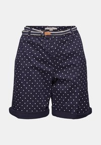 Shorts bleu marine à pois blancs, ourlets retroussés, et une ceinture tressée blanche et marron passée dans les passants.