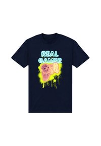 Navy blue cotton T-shirt featuring a neon yellow and pink graphic of a game controller with the text "REAL GAMER" in neon blue.